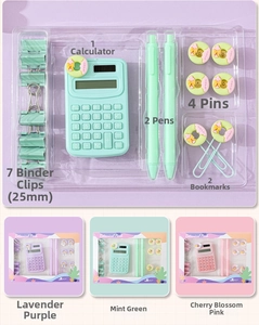 Detail view of macaron stationery set including mini calculator, pens, and paper clips