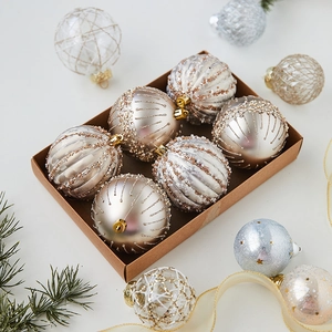 Champagne gold Christmas ball ornaments set in kraft box with glitter and branch accents