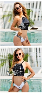 Detailansicht weißer Denim-Shorts mit Fransen und LOVE-Stickerei am Taillenbund