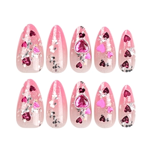 Pink gradient stiletto press-on nails with heart gemstones and silver glitter accents
