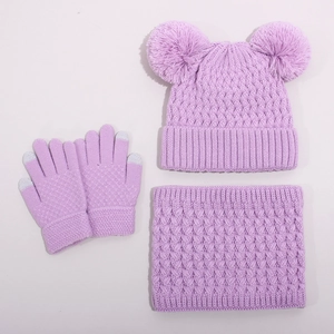 Detailed knit texture of lavender winter set with thick pompom hat and warm scarf