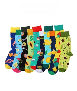 Flat lay of colorful cotton crew socks featuring various creative fruit and food patterns