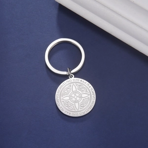 Macro shot of silver stainless steel keychain featuring an intricate Celtic knot pendant