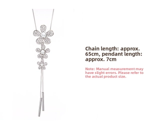 Detail view of 65cm sweater necklace with rhinestone floral pendant and white pearls