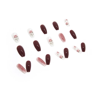 Glossy long coffin press-on nails with rose floral patterns and deep burgundy red finish