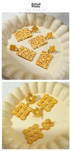 Detailed macro view of gold geometric woven textures on vintage stainless steel earrings