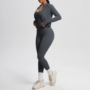 Detail of dark grey three-piece yoga set with brushed fabric and high-waist leggings