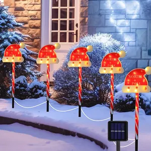 Solar powered Christmas candy cane path lights with red Santa hat LED garden markers