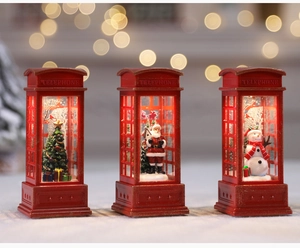 Macro detail of LED Christmas telephone booth lanterns with Santa and snowman scenes