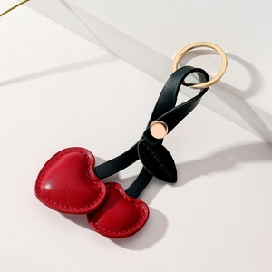 Creative PU leather cherry keychain with red heart-shaped fruits and golden metal ring