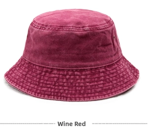 Detail of wine red washed cotton bucket hat with parallel stitching and metal eyelets
