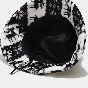 Winter plush bucket hat with reindeer and snowflake pattern and adjustable inner strap