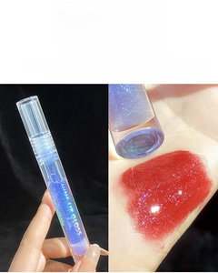 Macro detail of shimmer lip gloss in shade 05 Blue Sea Salt with glitter finish