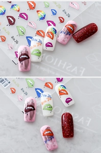 Detailed view of 5D vampire lips and Bite Me nail art decals on various nail tips