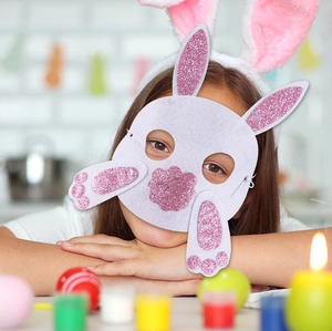 Kids felt Easter bunny mask with pink glitter ears and matching headband on a child