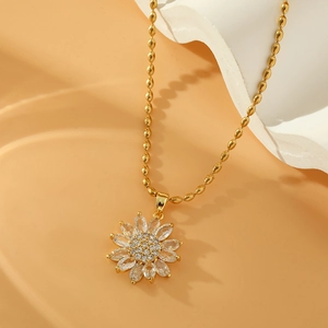 Golden sunflower necklace with sparkling zircon crystals on an elegant bead chain