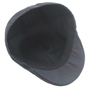 Detail view of the flat cap showing breathable mesh lining and elastic sweatband