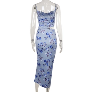 Close-up of the back detail on a blue floral dress featuring waist cut-out and tie straps