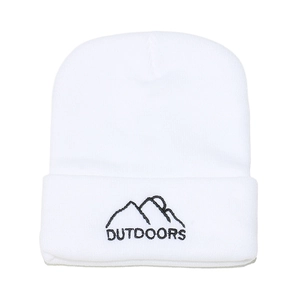 Close-up of white knitted beanie featuring black mountain peak embroidery and outdoors text