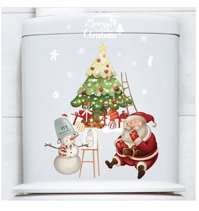 Close-up of Merry Christmas toilet tank decals with Santa and snowman on white ceramic