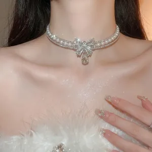 Double-layer pearl choker with crystal bow pendant and teardrop stone for women