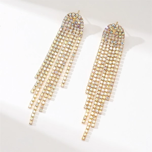 Detail shot of long gold tassel earrings with glittering colorful rhinestones on white