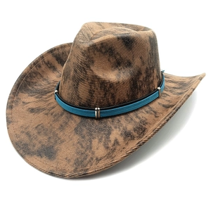 Detail of vintage western cowboy hat with blue suede band and silver metal buckles