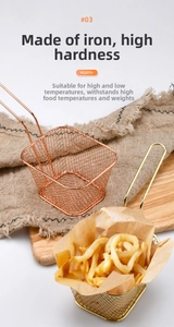 Detail of mini gold and rose gold stainless steel frying baskets on a wooden board