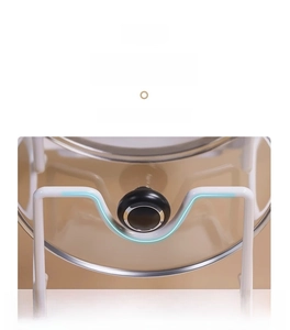 Detail of white metal pot lid rack with deep U-shaped groove for secure handle placement