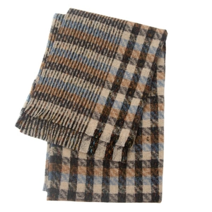 Detailed view of the checkered scarf featuring fringe edges in beige brown and blue