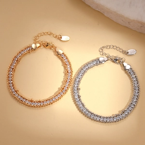 Elegant gold and silver link bracelets with pavé zircons in a minimalist luxury style