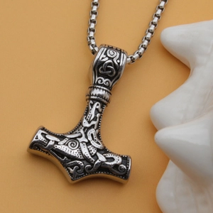 Silver Viking Mjolnir pendant necklace with intricate Thor's Hammer Celtic knotwork