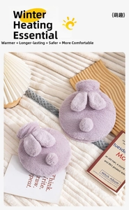 Plush purple rabbit water bottle cover with cute 3D ears and tail on a cozy blanket
