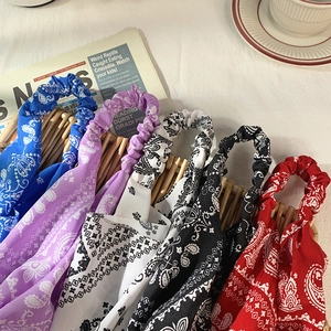 Elastic paisley print headbands in blue, purple, white, black and red for women