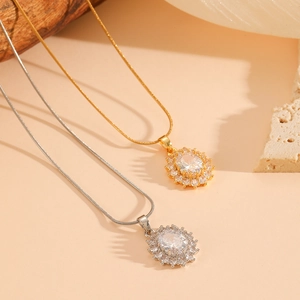 Minimalist oval pendant necklaces with full diamonds in gold and silver steel finish