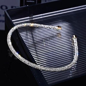 Macro detail of luxury rhinestone headband with sparkling stones and metal end caps