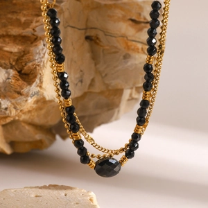 Three-layer 18k gold stainless steel necklace with black natural stone oval pendant