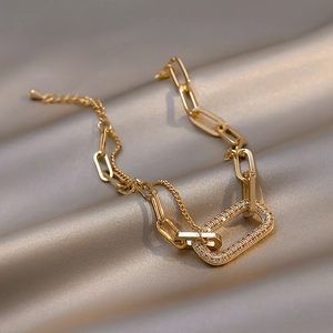 Elegant gold double-layer chain bracelet with a sparkling zircon rectangular link on silk