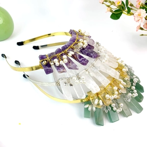Detail of handmade crystal crown headbands with colorful raw stones and pearls