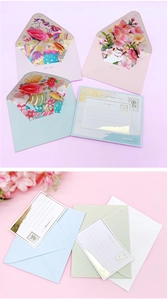 Close-up of 3D pop-up greeting cards with unicorn and cat designs with gold foil details