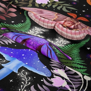 Detailed fabric texture of a moon phase tapestry with moth and botanical patterns
