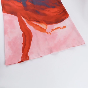 Detailed view of the double-needle stitching on the pink floral print dress hemline