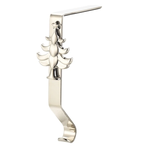 Detailed view of silver Christmas stocking hook with embossed tree design and metal finish