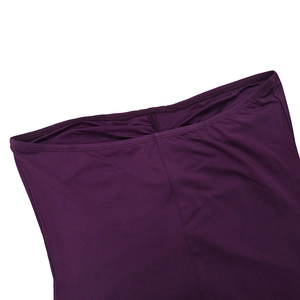 Detailed close-up of purple ruched fabric with smooth texture and double stitching seams
