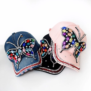 Distressed denim baseball caps for women with butterfly crystal and rhinestone accents