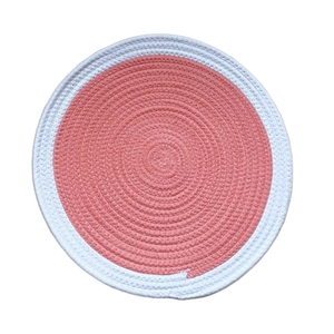 Thick round woven cotton placemat with pink center and white border for dining table