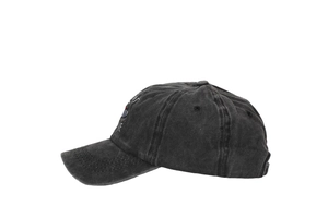 Detail of vintage washed dark gray baseball cap with blue and white side embroidery