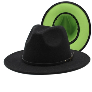 Detail of wool fedora with black exterior and neon green interior plus leather belt