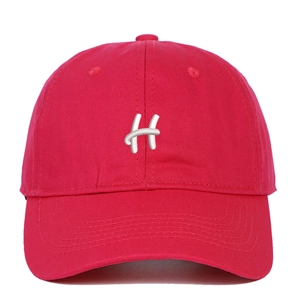 Detailed close-up of 3D white H letter embroidery on red cotton twill baseball cap