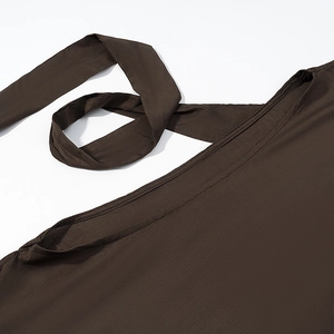 Close-up of textured bohemian top featuring dark brown crepe fabric and drawstring ties